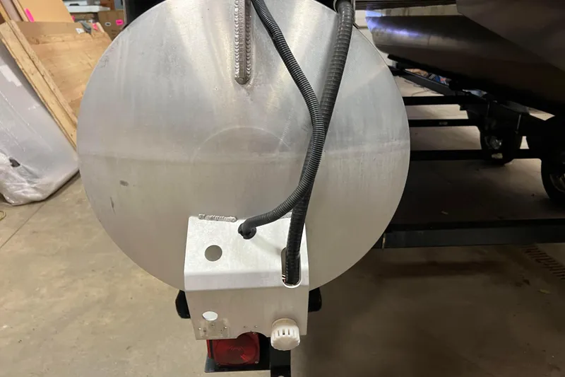 Slide: The Image of Rear view of 2014 Avalon Grand Island 2485 QF pontoon boat in a garage. - 76