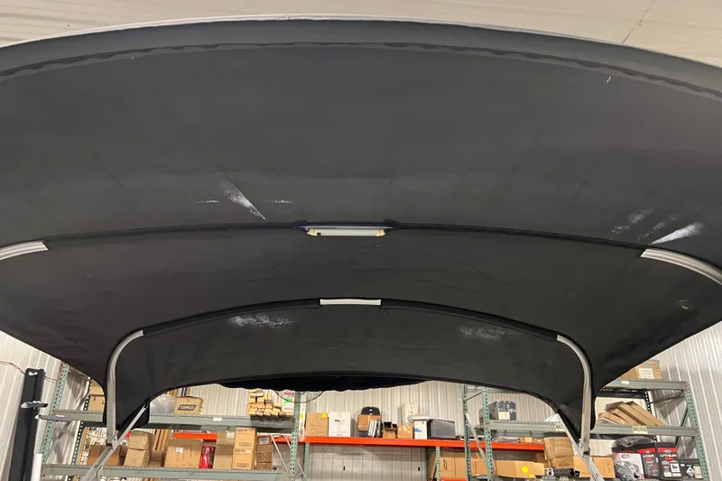 Slide: The Image of 2014 Avalon Grand Island 2485 QF boat canopy in storage facility. - 78
