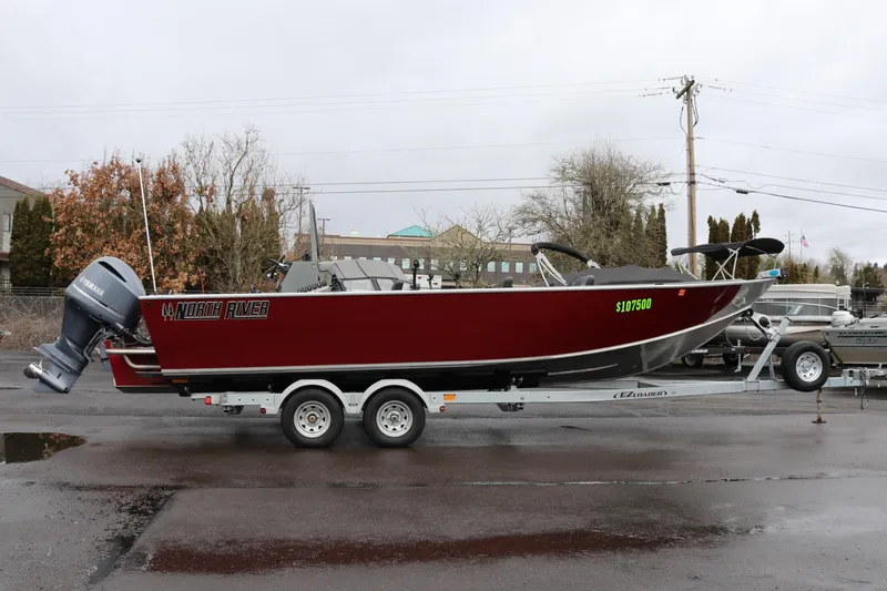 The Image of 2022 North River Osprey boat on trailer, featuring Yamaha outboard motor. - 1