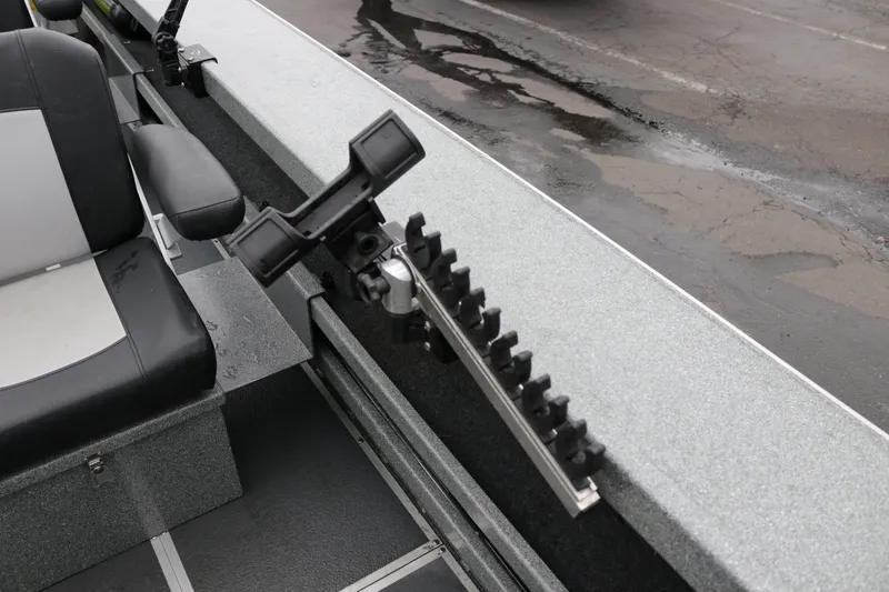 Slide: The Image of 2022 North River Osprey boat interior with rod holder and seating. - 18