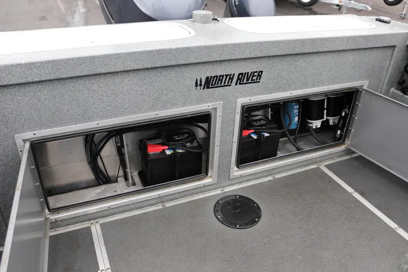Slide: The Image of 2022 North River Osprey boat battery compartments with visible wiring and components. - 20