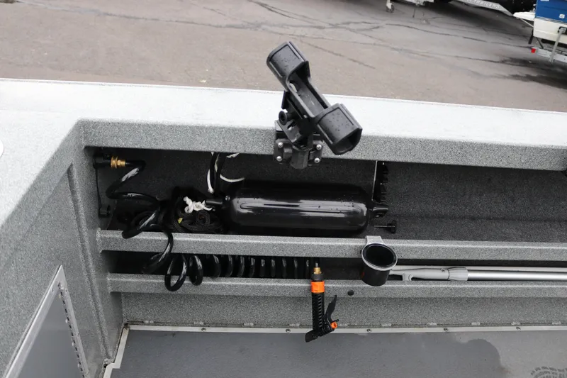 Slide: The Image of Storage compartment of a 2022 North River Osprey boat with fishing rod holder. - 21