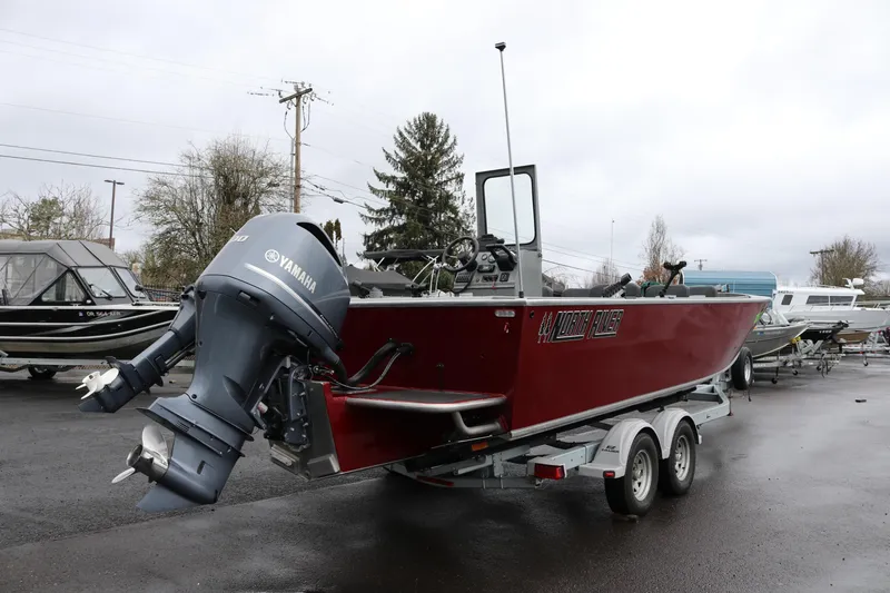 Slide: The Image of 2022 North River Osprey boat with Yamaha outboard motor on a trailer. - 5