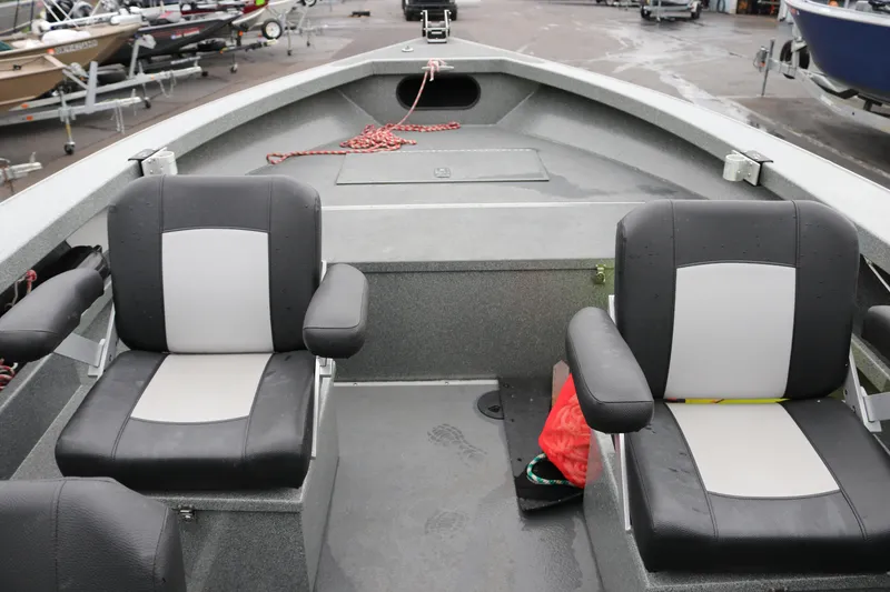 Slide: The Image of 2022 North River Osprey boat interior with two black and gray seats. - 7