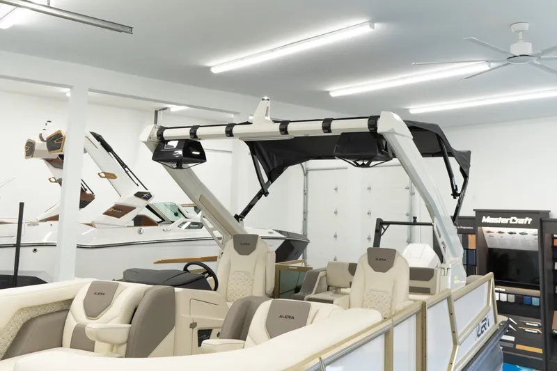 Slide: The Image of Luxury Alera M23Q boat, 2026 model, showcased in a modern indoor showroom. - 3