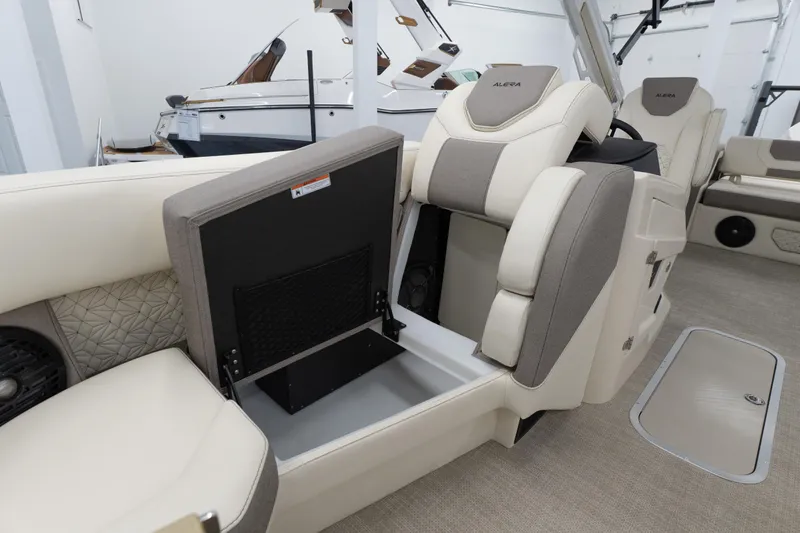 Slide: The Image of Luxury interior of 2026 Alera M23Q boat with plush seating and storage compartments. - 8