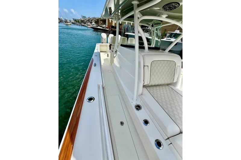 Slide: The Image of 2024 Valhalla Boatworks V-37, sleek design, luxurious seating, docked in marina. - 9