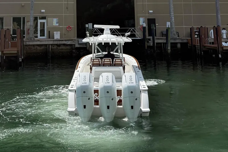 Slide: The Image of 2024 Valhalla Boatworks V-37 with triple engines, docked in a marina. - 4