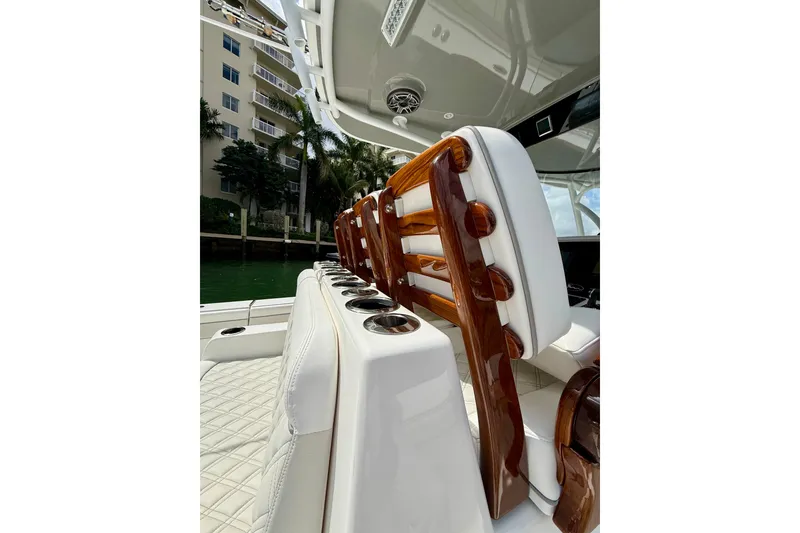 Slide: The Image of 2024 Valhalla Boatworks V-37 interior with luxurious seating and polished wood accents. - 11
