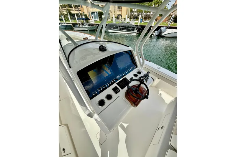 Slide: The Image of 2024 Valhalla Boatworks V-37 helm with advanced navigation display and controls. - 8