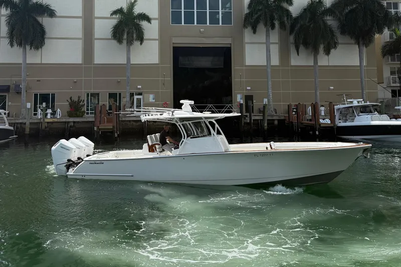 The Image of 2024 Valhalla Boatworks V-37 on water with palm trees backdrop. - 0