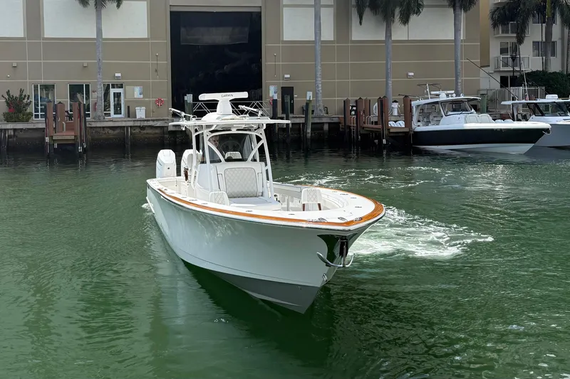 Slide: The Image of 2024 Valhalla Boatworks V-37 cruising in marina, showcasing sleek design and modern features. - 6