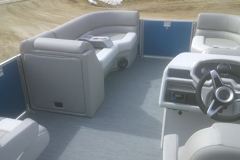 Slide: The Image of Interior of 2026 Godfrey EX 2286 SBX pontoon boat with modern seating and steering console. - 7