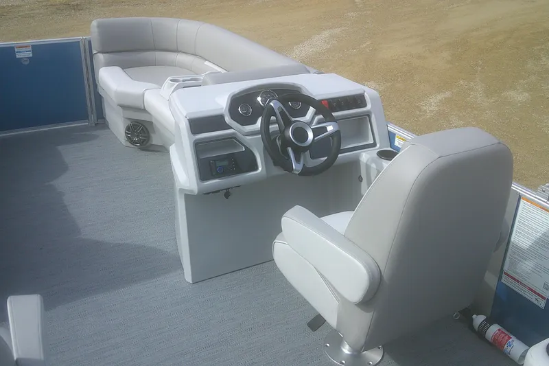 Slide: The Image of 2026 Godfrey EX 2286 SBX boat interior with steering console and seating. - 8