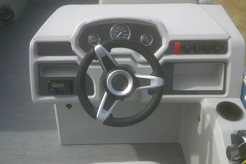 Slide: The Image of Steering console of 2026 Godfrey EX 2286 SBX boat with modern controls. - 9