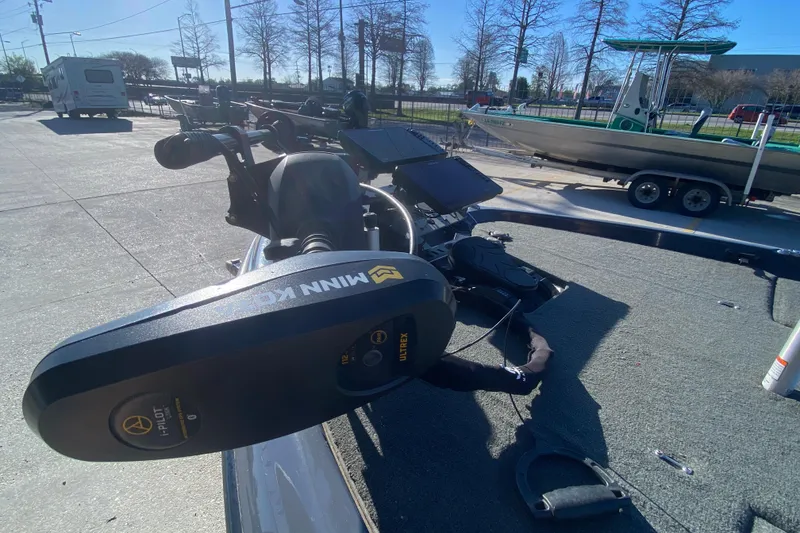 Slide: The Image of 2020 Skeeter FXR20 Limited boat with Minn Kota trolling motor in a parking area. - 11