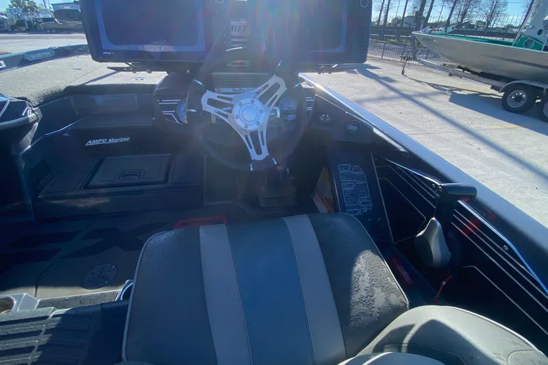 Slide: The Image of 2020 Skeeter FXR20 Limited boat cockpit with steering wheel and control panel. - 22