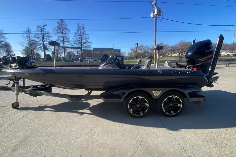 Slide: The Image of 2020 Skeeter FXR20 Limited bass boat with Yamaha engine on trailer. - 7