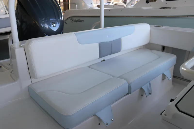 Slide: The Image of 2026 Robalo R202 Explorer boat seating area with cushioned bench. - 10