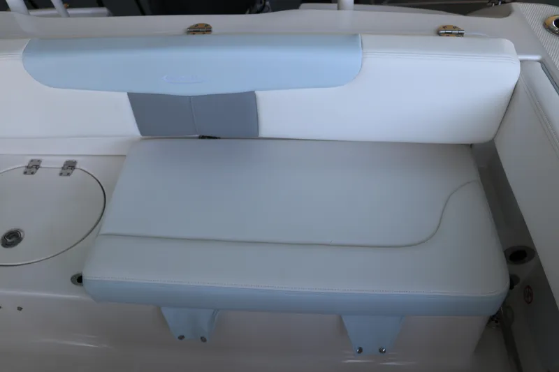 Slide: The Image of 2026 Robalo R202 Explorer boat seat, white and blue upholstery, sleek design. - 13