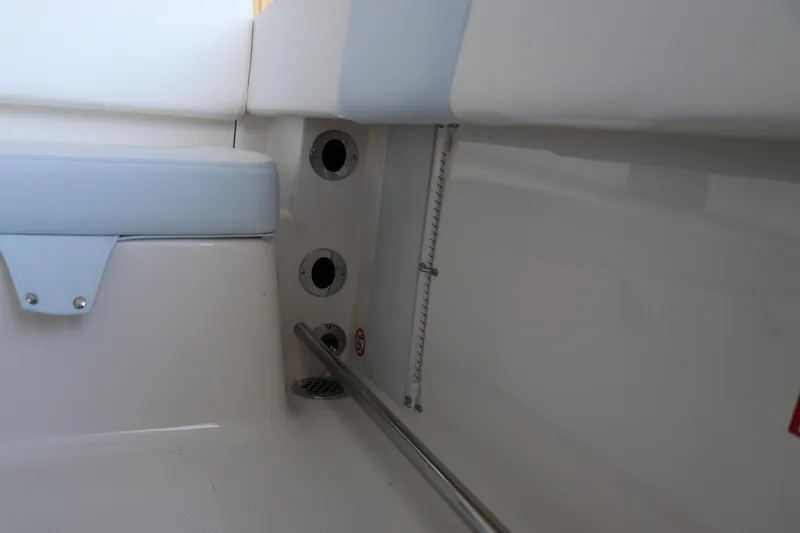 Slide: The Image of Interior detail of 2026 Robalo R202 Explorer boat, featuring seating and drainage system. - 15