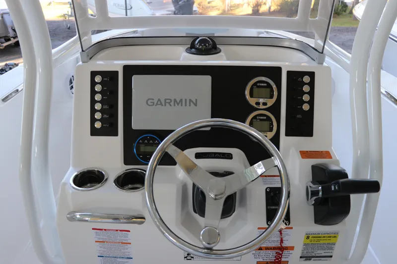 Slide: The Image of 2026 Robalo R202 Explorer boat dashboard with Garmin navigation system and steering wheel. - 19