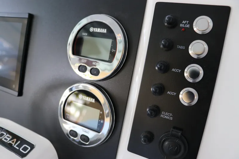 Slide: The Image of Dashboard of 2026 Robalo R202 Explorer with Yamaha gauges and control panel. - 23