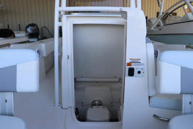 Slide: The Image of 2026 Robalo R202 Explorer boat interior with open storage compartment. - 28