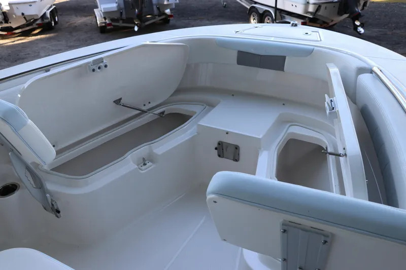 Slide: The Image of 2026 Robalo R202 Explorer boat interior with open storage compartments. - 32