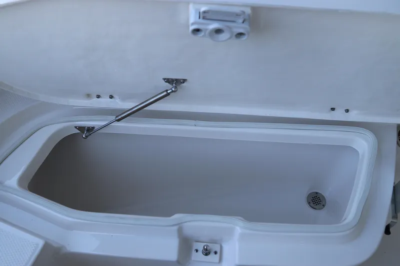 Slide: The Image of Open storage compartment in 2026 Robalo R202 Explorer boat. - 33
