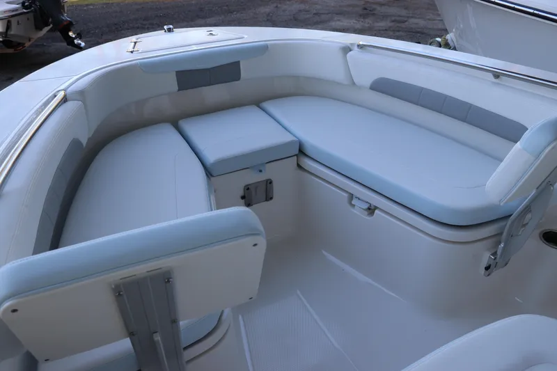 Slide: The Image of 2026 Robalo R202 Explorer boat interior with cushioned seating and sleek design. - 35