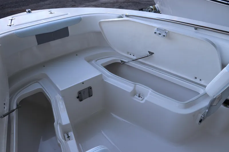 Slide: The Image of Open storage compartment on 2026 Robalo R202 Explorer boat, showcasing spacious interior design. - 37
