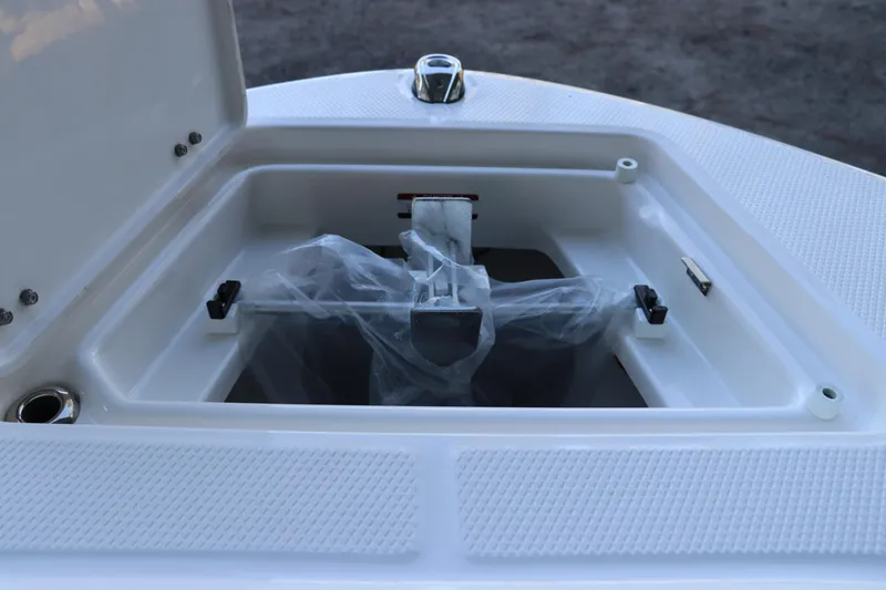 Slide: The Image of 2026 Robalo R202 Explorer anchor storage compartment with open lid. - 41