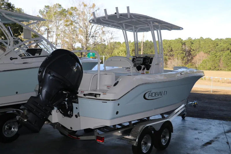 Slide: The Image of 2026 Robalo R202 Explorer boat on trailer, outdoor setting, rear view. - 5