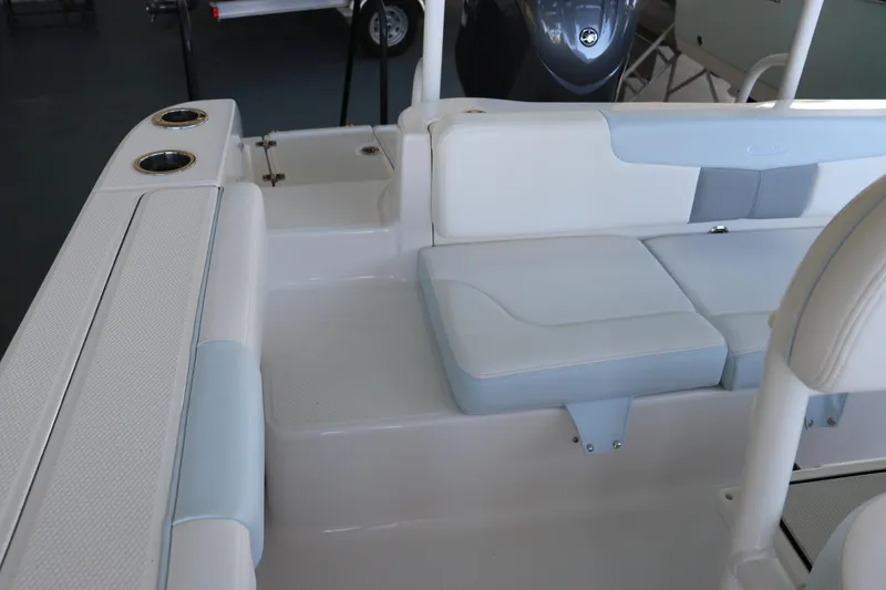 Slide: The Image of 2026 Robalo R202 Explorer boat interior with white and blue seating. - 8