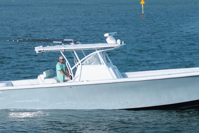 Slide: The Image of 2012 SeaHunter 37 Tournament boat cruising on open water. - 2