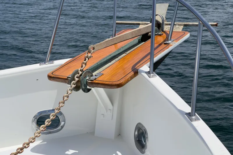 Slide: The Image of Bow of a 1971 Grand Banks boat with anchor chain and wooden deck detail. - 12