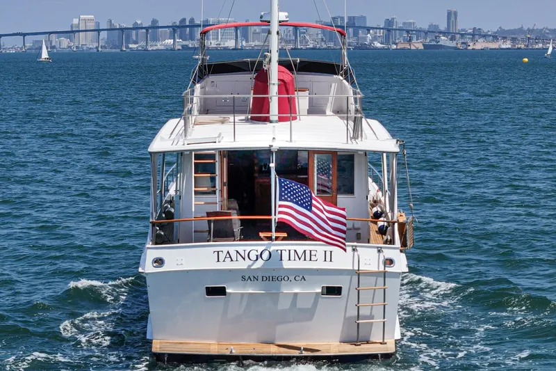 Slide: The Image of 1971 Grand Banks yacht "Tango Time II" cruising in San Diego Bay with city skyline. - 19