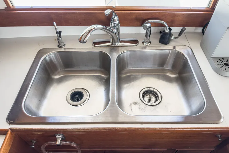 Slide: The Image of Stainless steel double sink on a 1971 Grand Banks boat. - 34