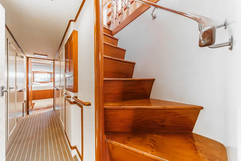 Slide: The Image of Interior of a 1971 Grand Banks yacht with wooden stairs and hallway. - 35