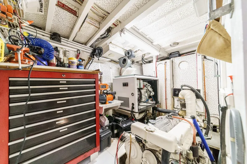 Slide: The Image of Engine room of a 1971 Grand Banks boat with tools and equipment. - 52