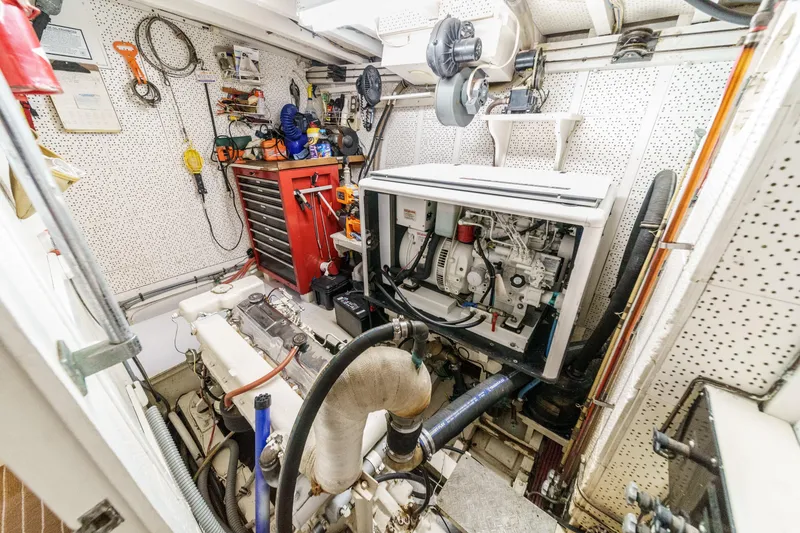 Slide: The Image of Engine room of a 1971 Grand Banks boat with tools and equipment. - 53