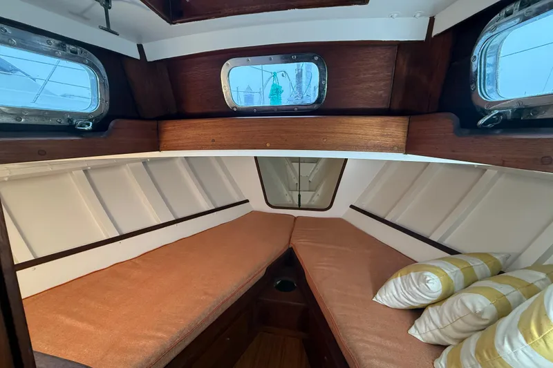 Slide: The Image of Interior of a 1962 Lapworth Sloop with cozy cabin and porthole windows. - 28