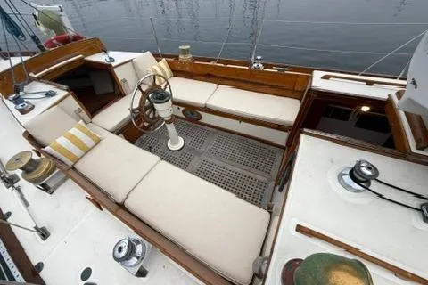 Slide: The Image of 1962 Lapworth Sloop sailboat cockpit with cushioned seating and wooden accents. - 6