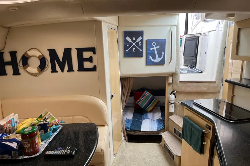 Slide: The Image of Interior of 2001 Maxum 3300 SCR boat with cozy decor and nautical theme. - 10