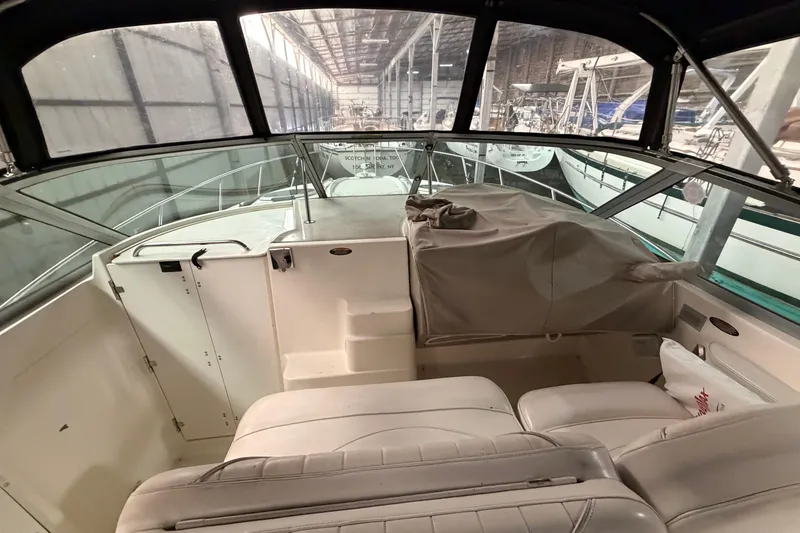 Slide: The Image of 2001 Maxum 3300 SCR boat interior in a marina storage facility. - 22