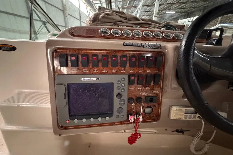 Slide: The Image of Control panel of a 2001 Maxum 3300 SCR boat with navigation equipment. - 25