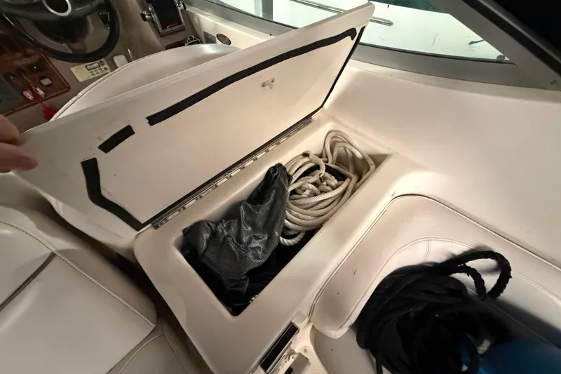 Slide: The Image of Storage compartment with ropes on a 2001 Maxum 3300 SCR boat. - 28