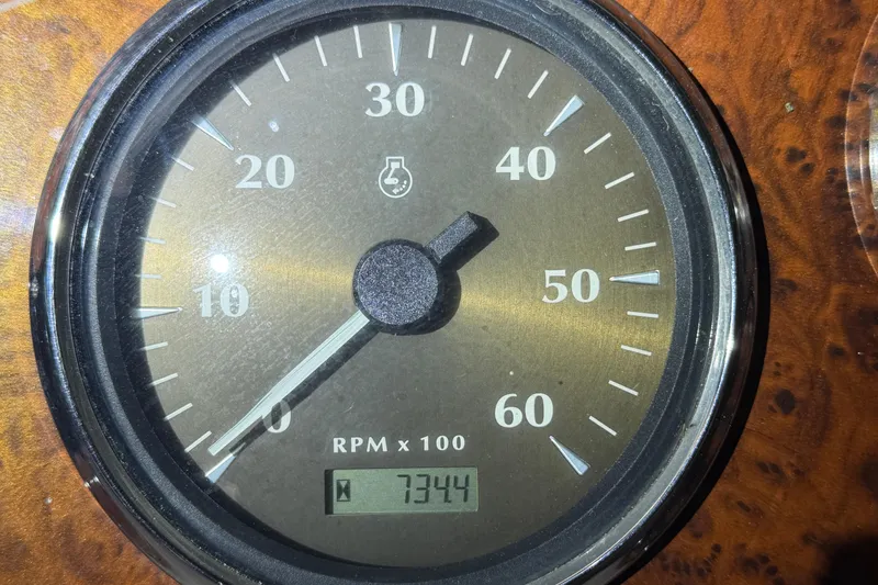 Slide: The Image of Close-up of a 2001 Maxum 3300 SCR tachometer showing 7344 RPM. - 29