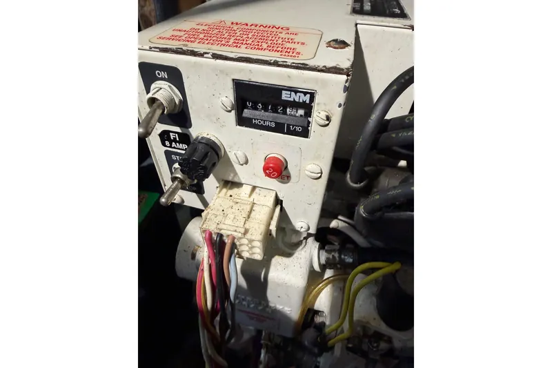 Slide: The Image of Control panel of a 2001 Maxum 3300 SCR boat with switches and wiring. - 31